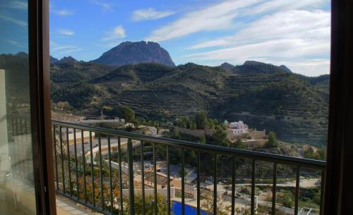 a view of a mountain from a balcony at Alojamientos Turisticos Isa i Toni in Sella