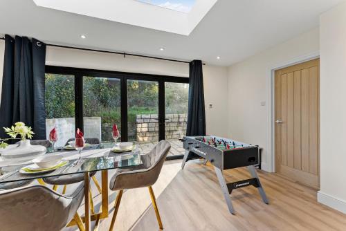 a living room with a table with a foosball at Amazing Rural Retreat in The Cotswolds - Parking in Frome