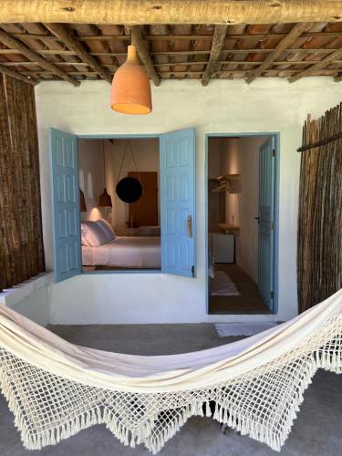 Ένα ή περισσότερα κρεβάτια σε δωμάτιο στο Pousada Quintal Caraíva