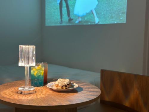 a table with a plate of food and a lamp at Gurida Bupyeong in Incheon
