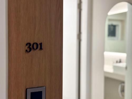 a door with the number on it in a bathroom at Gurida Bupyeong in Incheon