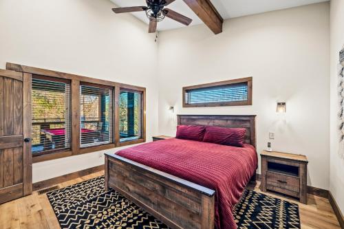a bedroom with a large bed and a ceiling fan at Downtown Dreamin in Gatlinburg