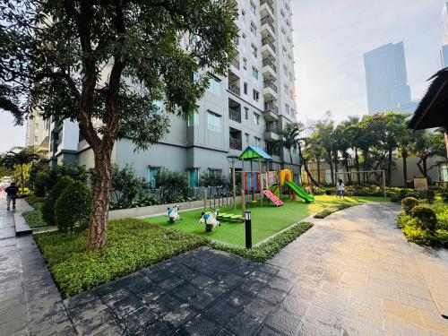 a park with children playing on a playground at Emaar Moslem Friendly Stunning Comfy 2BR Apartment at the heart of Jakarta in Jakarta