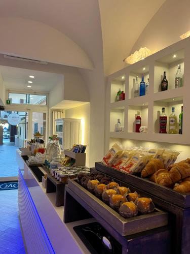 a bakery with a variety of pastries on display at Hotel Marina Charming Rooms in Finale Ligure