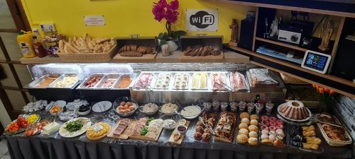 a display case with many different types of food at Penzion na Lůkách in Horní Bečva