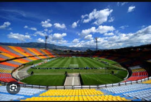 a view of an empty stadium with a field at Habitación 3 en Casa Retro in Medellín