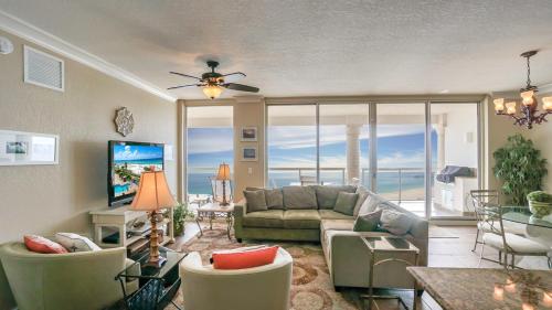 a living room with a view of the ocean at Beach Club Gulf Front 3B Condo - 1204 in Pensacola Beach