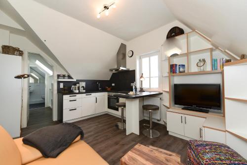Kuchyň nebo kuchyňský kout v ubytování Haus Poggfred Whg 05 Sönnen