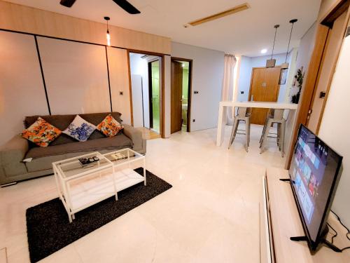 a living room with a couch and a tv at Vortex klcc by hr in Kuala Lumpur