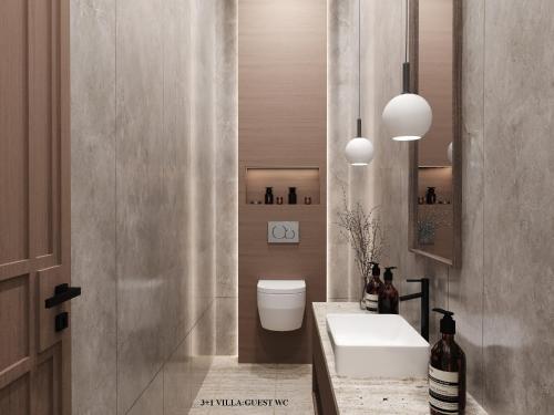 a bathroom with a white toilet and a sink at Bali Investment Agency in Ubud