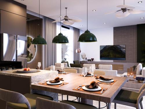 a dining room with a table and chairs at Bali Investment Agency in Ubud
