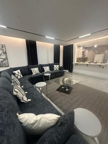 a living room with a couch and a table at Jamal Royal Apartments in Al Madinah