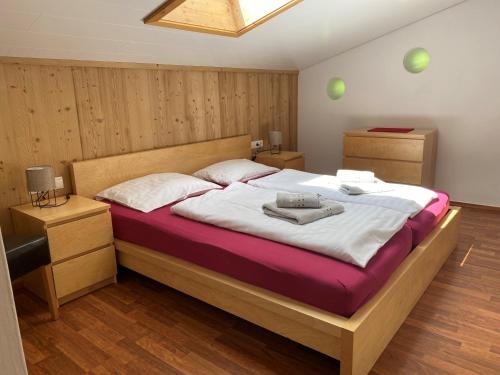 a bedroom with a large bed in a room at Haus Angelika in Vandans