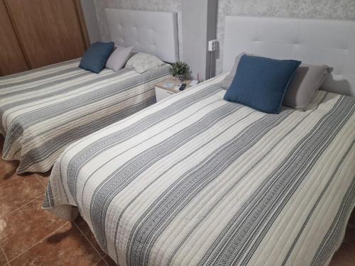 Postel nebo postele na pokoji v ubytování Habitaciones Zoe