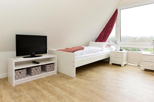 TV a/nebo společenská místnost v ubytování Pension Hilligenlei Zi 09 DZ