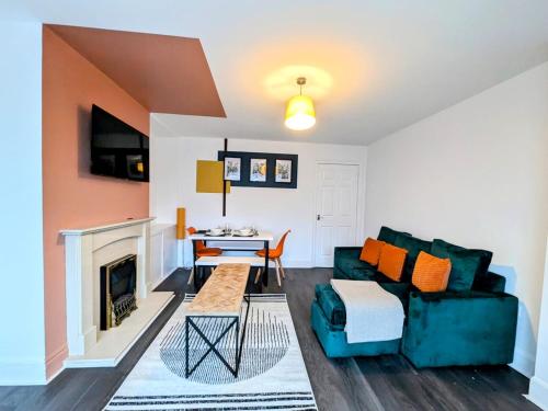 a living room with a couch and a table at Spacious 3 BDRM with Driveway , Garden, Blyth in Blythe