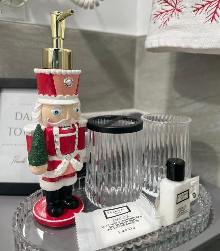 a santa claus figurine sitting on a glass tray at Pelham Haven Suite in New York in Pelham