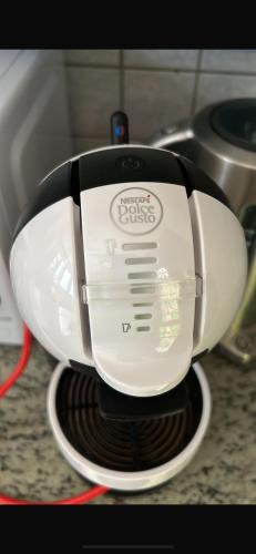 a toaster sitting on top of a stove at La maison du lac in Lutry