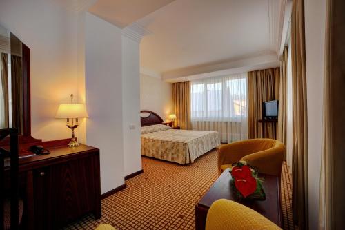 Tempat tidur dalam kamar di Hotel Citrin - Adults Only