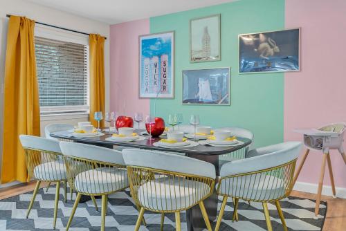 a dining room with a table and chairs at Wes Anderson-Theme 5BD - Movie Theater & PingPong in Tulsa
