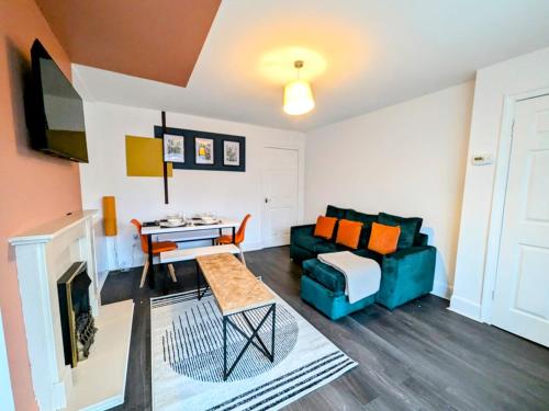 a living room with a couch and a table at Spacious 3 BDRM with Driveway , Garden, Blyth in Blythe