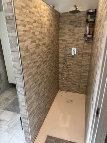 a bathroom with a shower with a glass door at Rose e Frutta - Sweet Dreams in Begliano