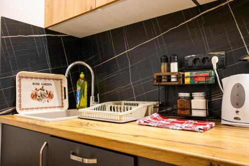 a kitchen counter with a laptop on top of it at SKS plus in Pale