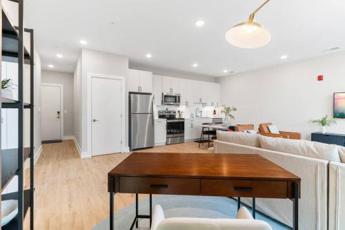 a living room with a couch and a table at Stunning 1-BD - City Views - Near Fishtown in Philadelphia