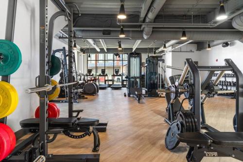 a gym with several treadmills and weights at Stunning 1-BD - City Views - Near Fishtown in Philadelphia