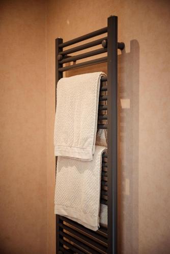 a towel rack with towels on it in a bathroom at Ferienhaus Eifeltoni in Nettersheim