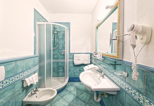 a bathroom with a sink and a shower at Corallo Blu Hotel De Charme - Sea & Spa access in Ischia