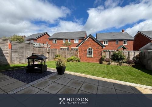 a brick house with a gazebo in a yard at 3 Bedroom Modern Property with Parking in Shrewsbury