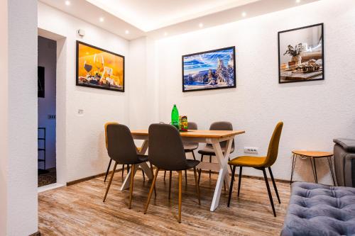 a dining room with a table and chairs at SKS plus in Pale