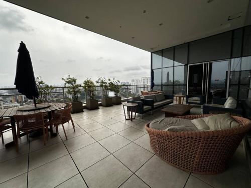 a balcony with a table and chairs on a building at The CittyPlex Experience in Osasco