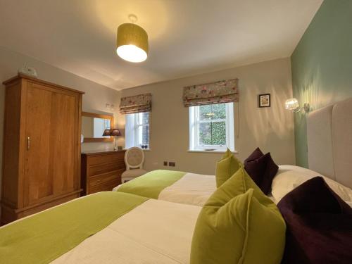 Ένα ή περισσότερα κρεβάτια σε δωμάτιο στο Bridge House Apartment 1