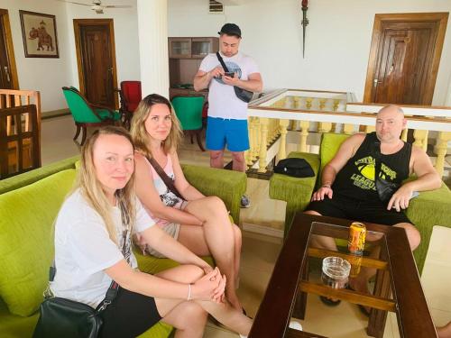 a group of people sitting in a living room at Lavinia Blue Hotel in Mount Lavinia