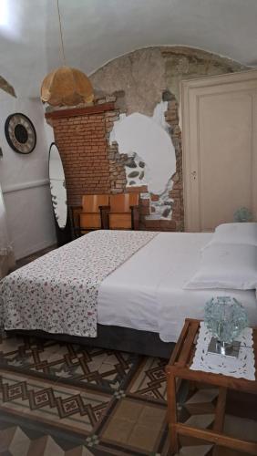 Postel nebo postele na pokoji v ubytování Appartamento in Corte Storica