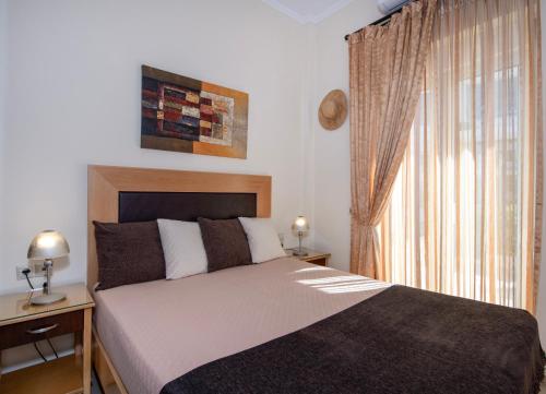Ένα ή περισσότερα κρεβάτια σε δωμάτιο στο Socrates Holidays Apt. 1 with Pool near the Beach