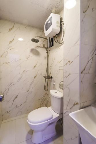 a bathroom with a white toilet and a sink at Rizq inn 2 at Hulhumale in Hulhumale