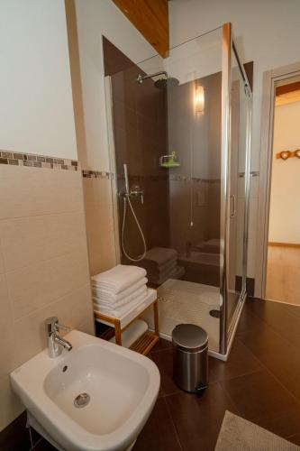 a bathroom with a sink and a shower at Casa Reit in Bormio