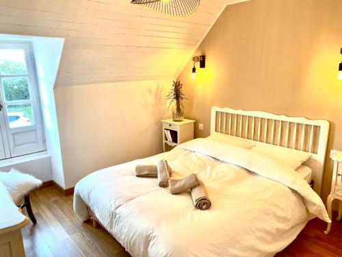 Ένα ή περισσότερα κρεβάτια σε δωμάτιο στο Gîtes Entre Terre et Mer