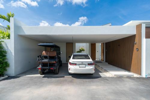 a car parked in front of a garage at Luxury villa 3-4 bedroom near Bangtao beach in Phuket Town