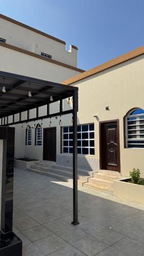 a large building with awning in front of it at Rukn Barka in Barka