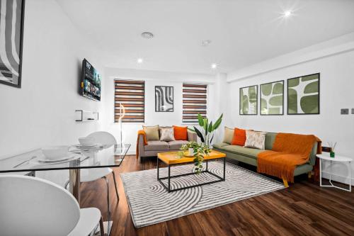 a living room with a couch and a table at Modern 1-Bed Apartment Sleeps 4 Birmingham in Birmingham