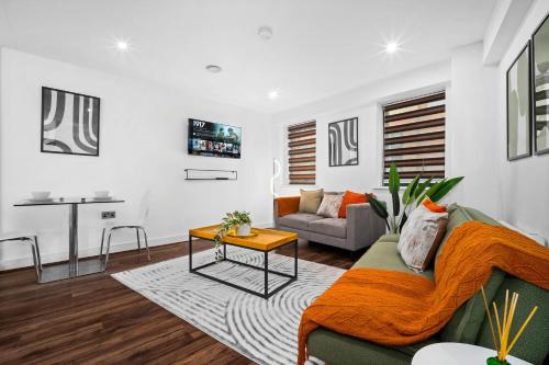 a living room with a couch and a table at Modern 1-Bed Apartment Sleeps 4 Birmingham in Birmingham