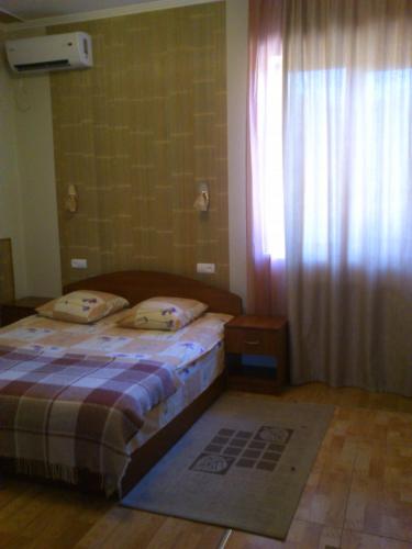 Postel nebo postele na pokoji v ubytování Pallada Motel