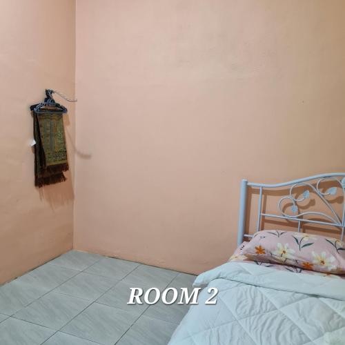 Postel nebo postele na pokoji v ubytování Ct Homestay