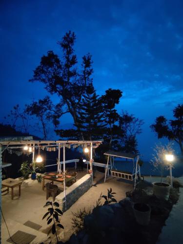 a view of a patio at night at The Sweven NeerVan in Rishīkesh