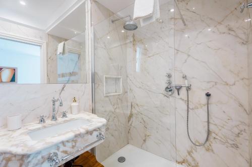 a bathroom with a sink and a shower at Casa e Arte in Sorrento