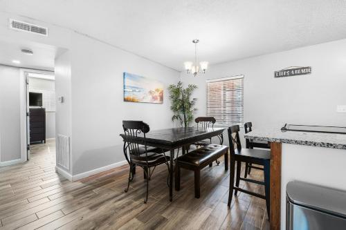 a kitchen and dining room with a table and chairs at Amazing, Oasis, Mins from the beach and Charleston, Free Wine in Charleston